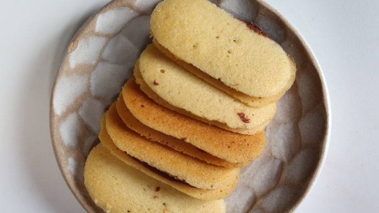 langues de chat french cookies assembled on a plate