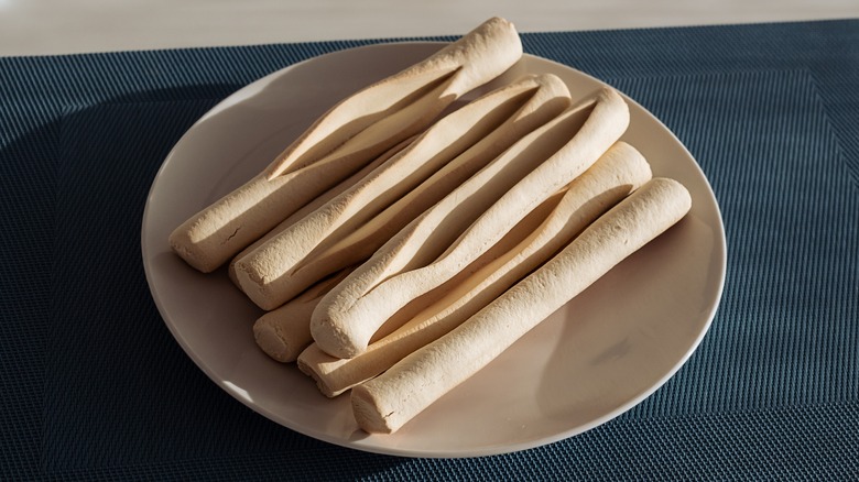 navettes de marseilles french cookies stacked on a plate