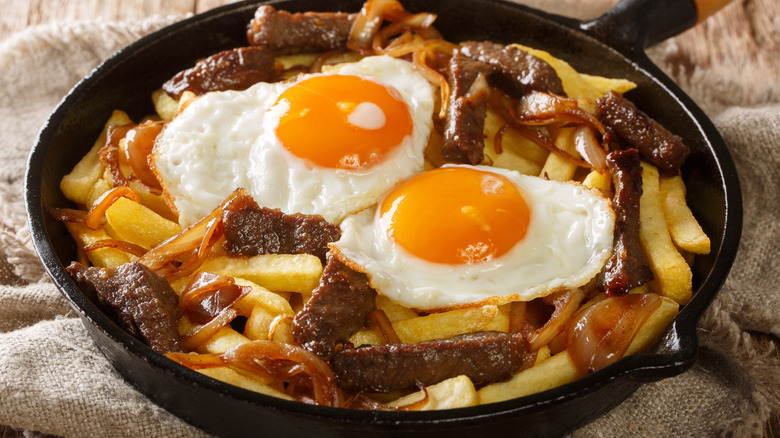 Chorrillana loaded fries in skillet