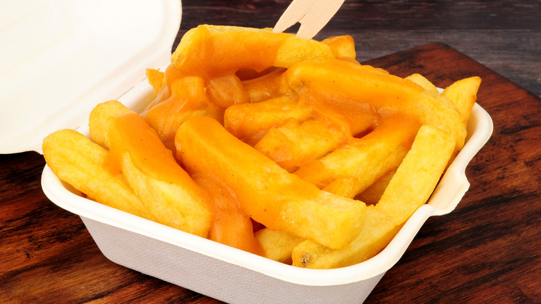 Curry chips in takeout container