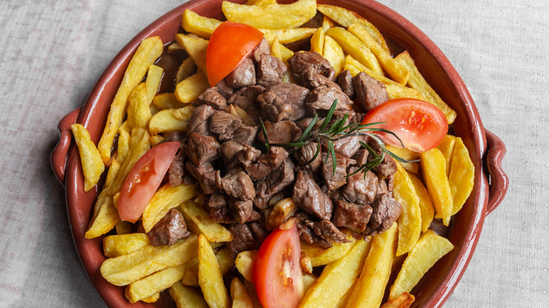 Traditional Portugese picado dish with fresh tomato slices