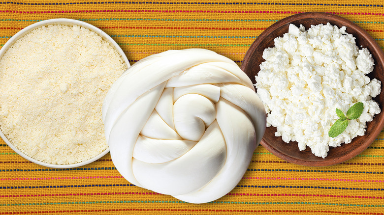 Three different types of Mexican cheese on a colorful cloth