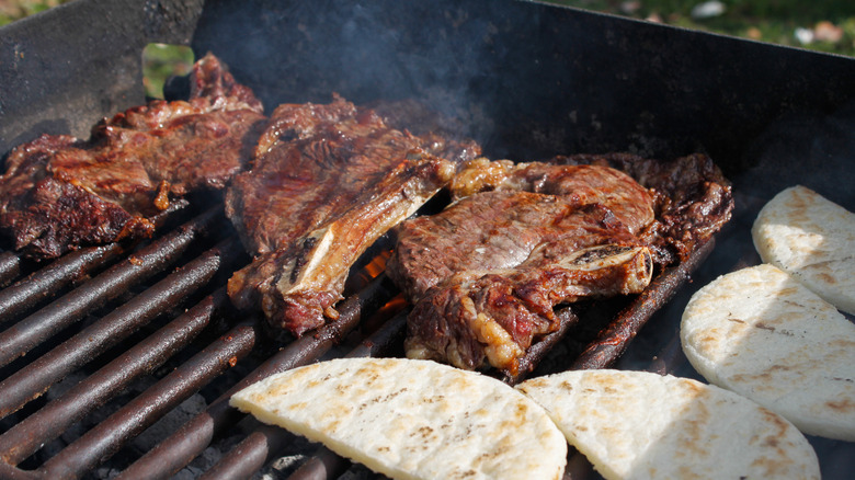 meat cooking on charcoal 