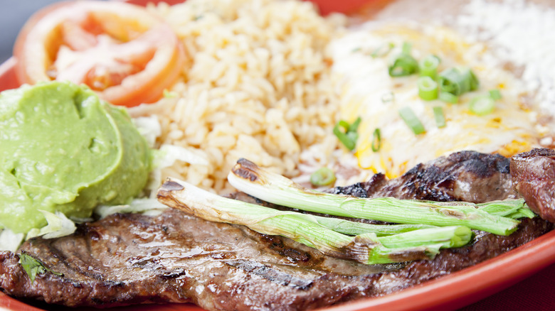 carne asada with guacamole and rice 