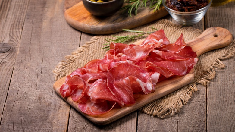 Slices of coppa on a wooden board