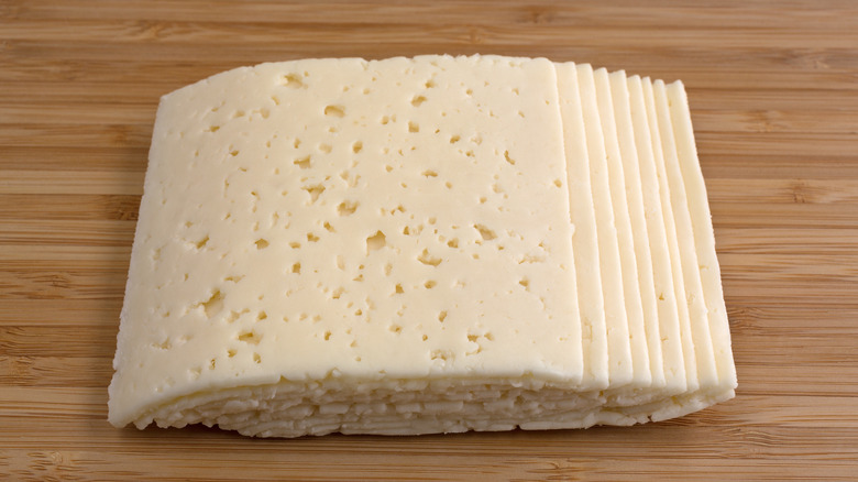 Multiple slices of havarti cheese on board