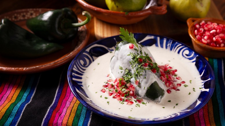 Chiles in nogada on table