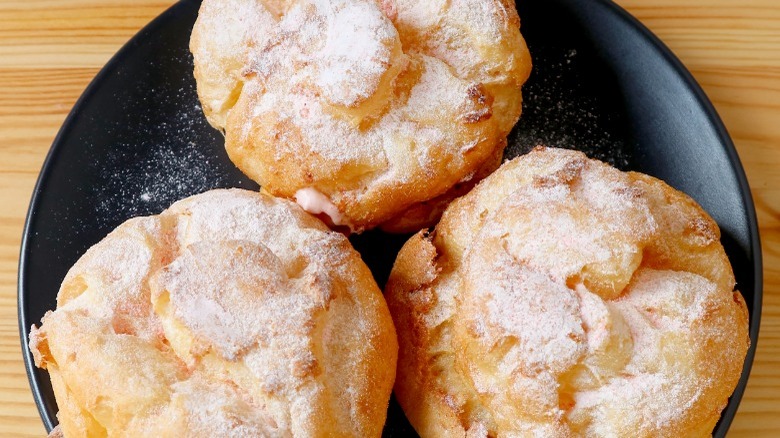 Cream puffs on plate