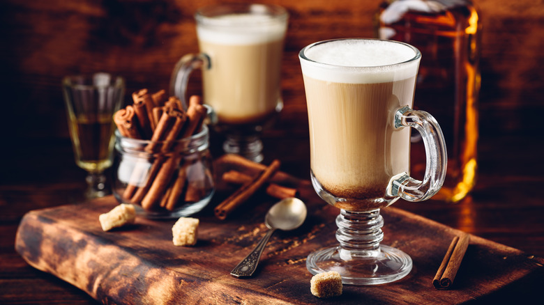 Mugs of Irish coffee with cinnamon 