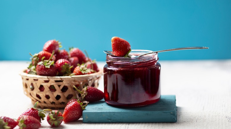 Jam jar and strawberries