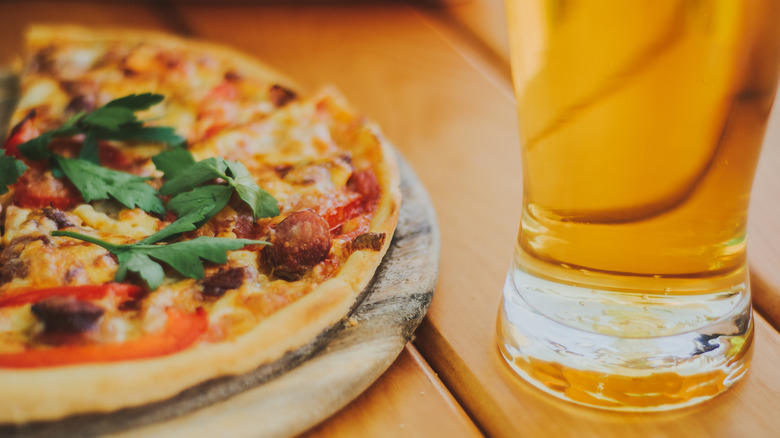 Pizza pie and golden beer