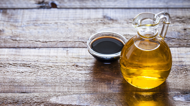 carafe of oil and cup of balsamic vinegar 