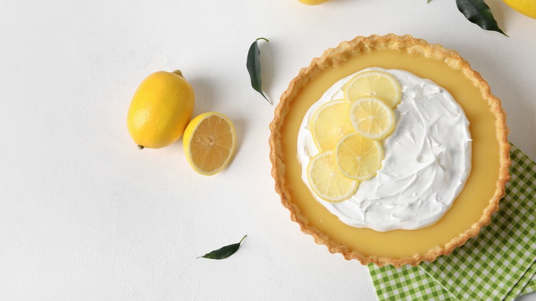 Yellow pie with whipped cream