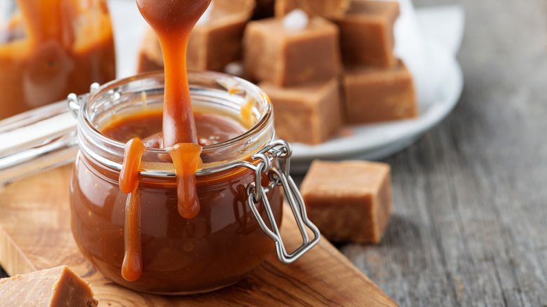 Caramel dripping into jar