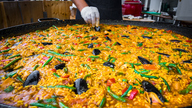 giant pan of paella with mussels