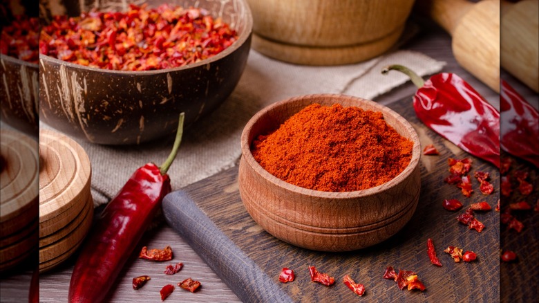 Bowl of chili powder with dried chilies