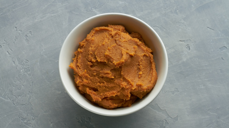 white bowl with brown miso paste