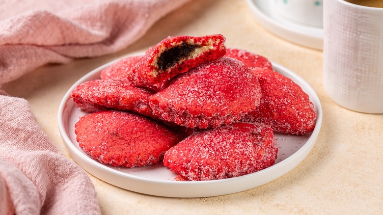 red stuffed cookies on plate