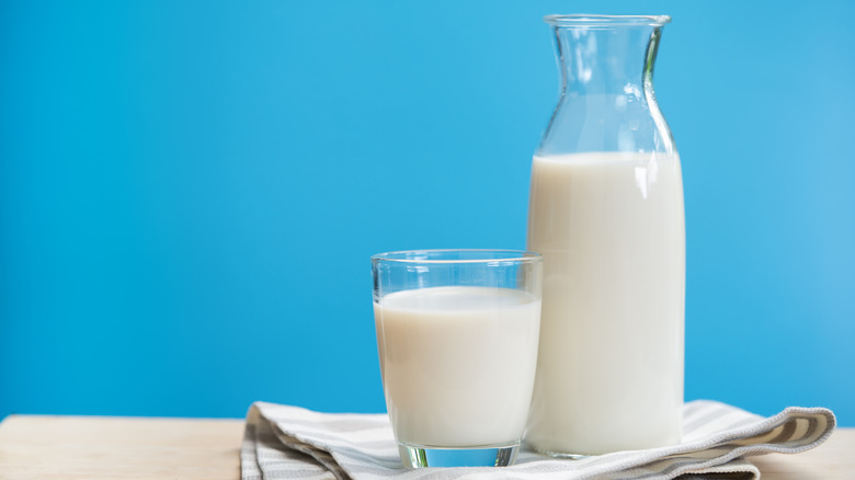 Glass and pitcher of milk