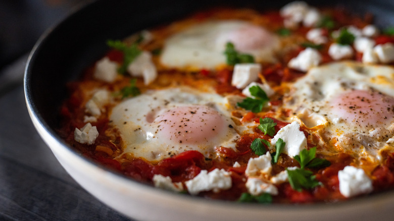 closeup shakshuka eggs plate feta 