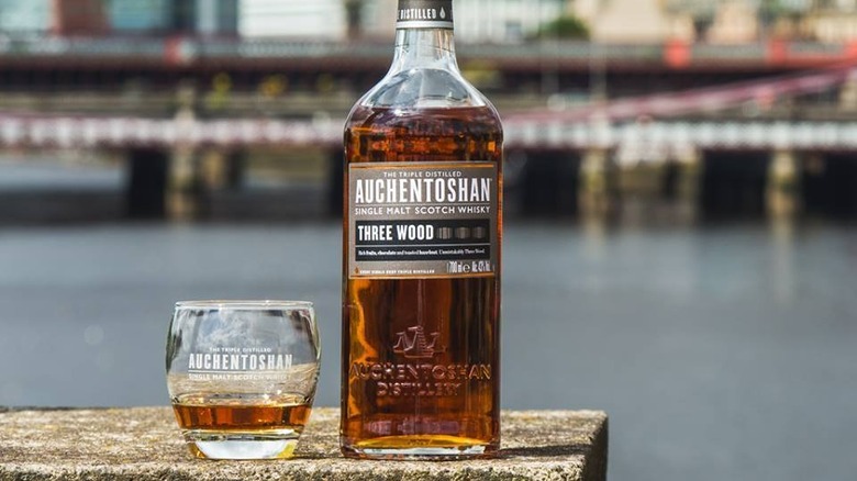 bottle and glass of Auchentoshan whisky