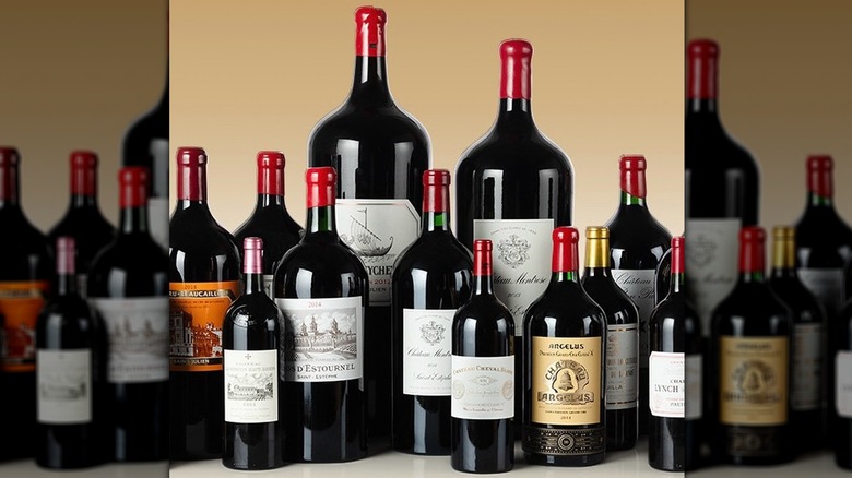 Group of varying sizes of Bordeaux wines