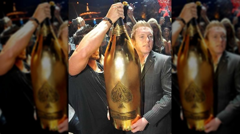 People holding a bottle of Ace of Spades Gold Brut Midas