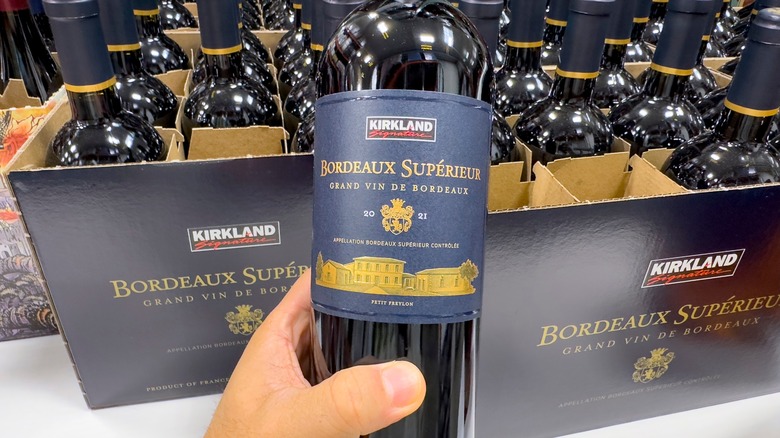 Handheld bottle of Kirkland Signature Bordeaux Supérieur