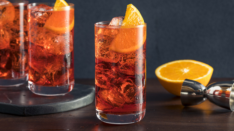 americano cocktail with orange wedge