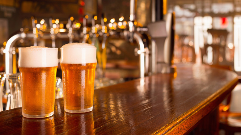 two beers on a bartop