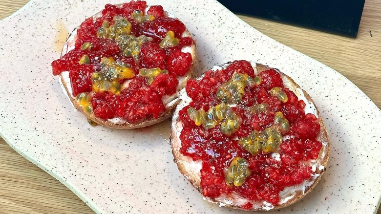 Bagel with raspberries and passionfruit