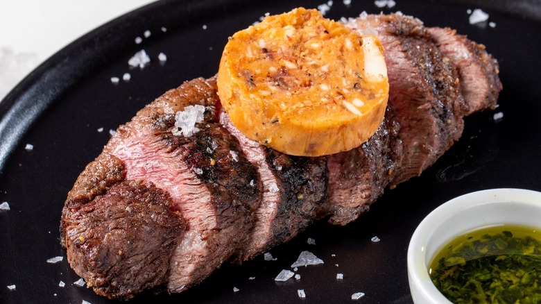 Sweet potato slice atop steak