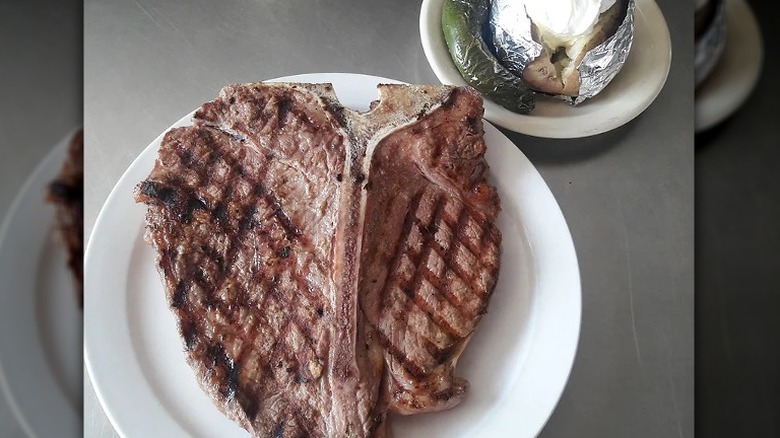 Cooked steak and French fries