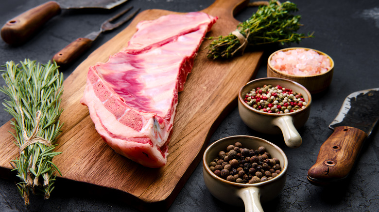 Raw lamb breast on cutting board