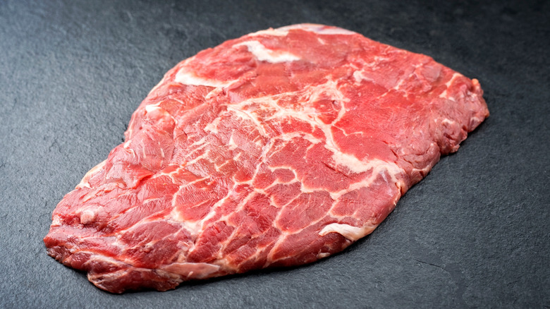 Wagyu petite tender steak on black background