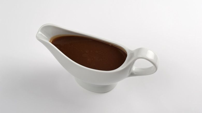 Full gravy boat on white