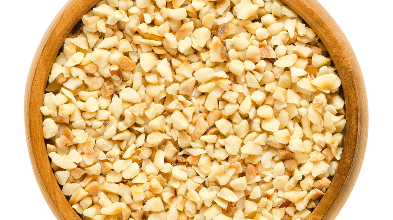 Chopped nuts in wooden bowl