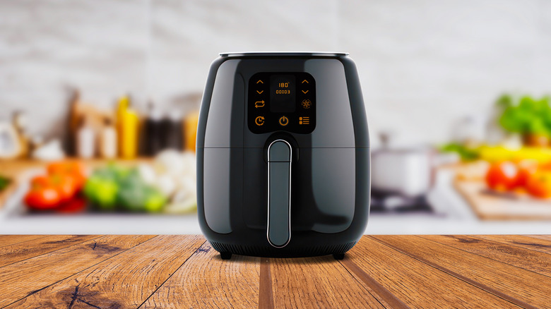 black air fryer on kitchen countertop