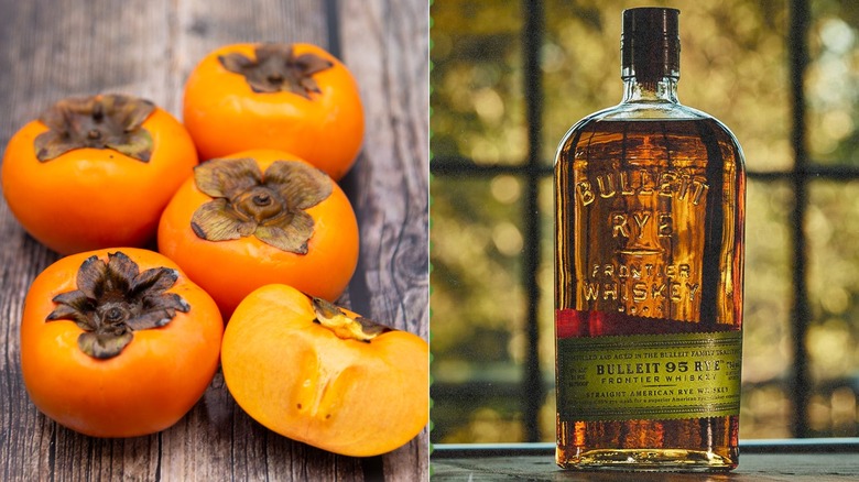 Persimmons on wooden table and bottle fo Bulleit Rye Bourbon