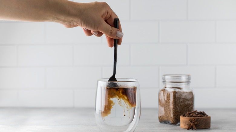 instant coffee stirred into water