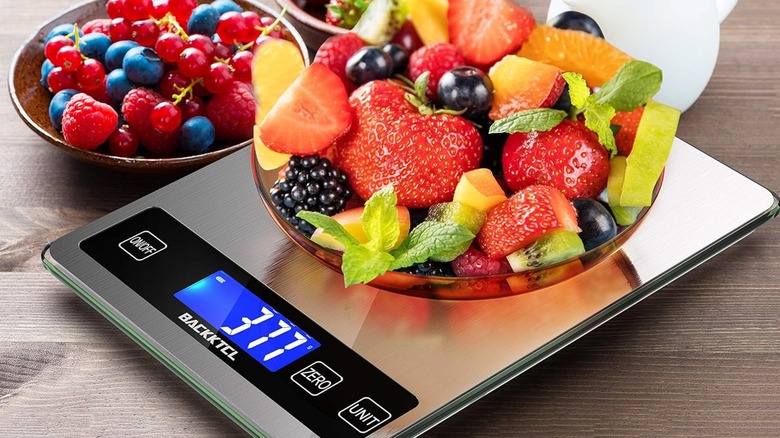 Weighing fruit on a Back Ktcl digital kitchen scale
