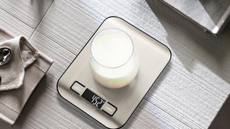 A glass of milk on a Crownful digital kitchen scale
