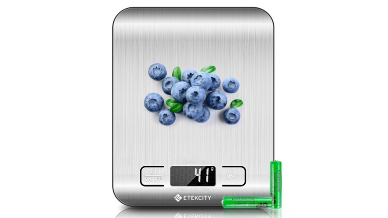 An Etekcity digital kitchen scale with blueberries on it