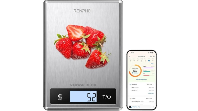A Renpho stainless steel scale with strawberries