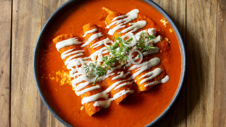 Brunch enchiladas in sauce