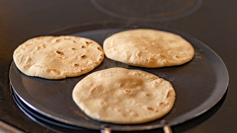 Heating tortillas in skillet