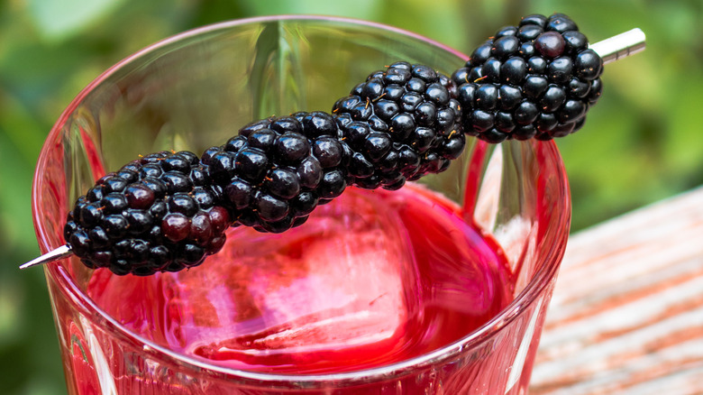 whiskey drink with blackberries