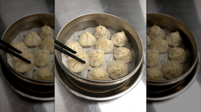 Soup dumpling with chopsticks