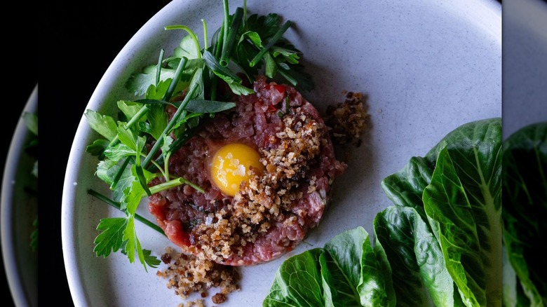 tartare on plate with baby gem