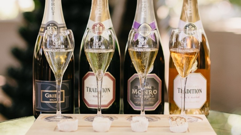 Four bubbly bottles and glasses